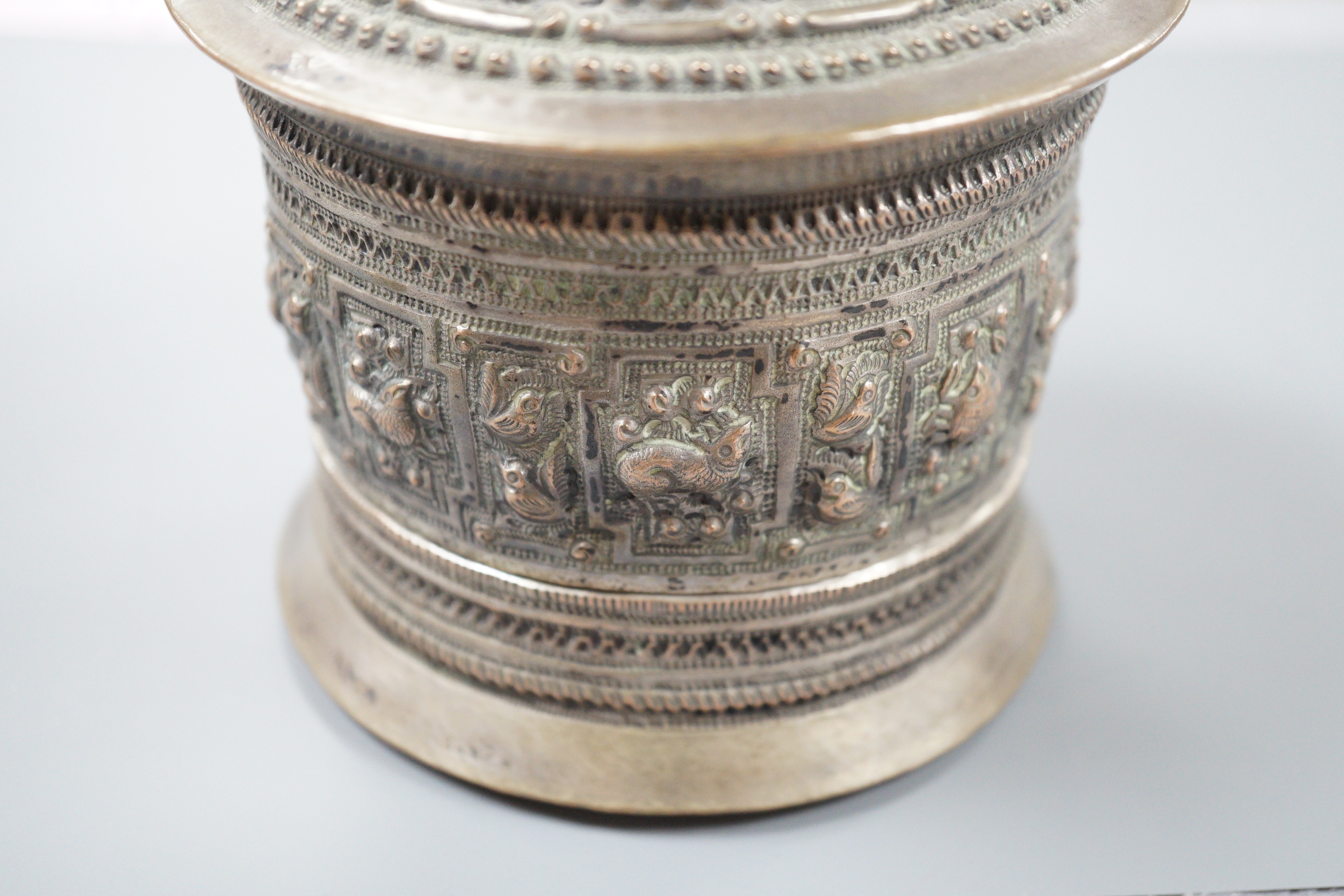 A 19th century Shan people white metal circular betel box and cover, Eastern Burma, height 10.5cm, 266 grams.